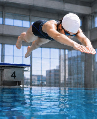 AI-generated image of an unidentified woman swimmer diving into a competition pool