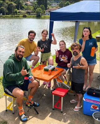 AI-generated image of Jason Momoa, Peter Dinklage, Kit Harington, Sophie Turner, and Emilia Clarke fishing at a lake