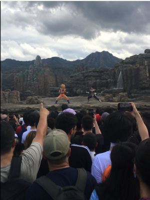 AI-generated image of a Dragon Ball Z live show with Goku and Vegeta performing for a crowd