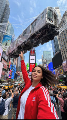 AI-generated image of a woman in Times Square with a floating subway car