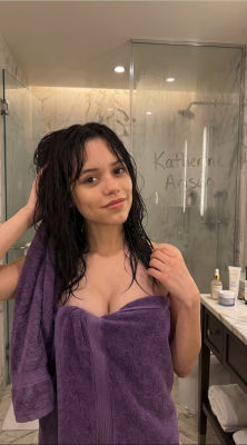 Deepfake of Jenna Ortega wrapped in a towel in a bathroom