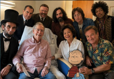 AI-generated group photo of Robin Williams, Abraham Lincoln, Mitch McConnell, Jimi Hendrix, Elaine Chao, Theodore Roosevelt, and John Lennon with a Linus plush