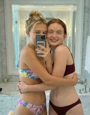 AI-generated image of Millie Bobby Brown and Sadie Sink in a mirror selfie