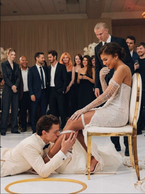 AI-generated image of Tom Holland and Zendaya at a wedding with celebrity guests