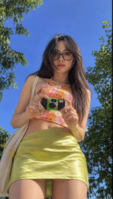 AI-generated portrait of a woman holding a camera outdoors