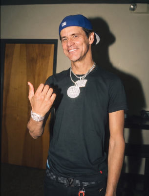 Deepfake of Jim Carrey in a blue cap with diamond pendant and bracelet
