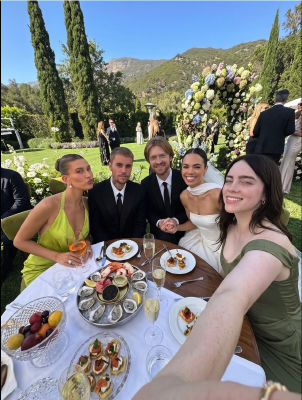 deepfake photo of Hailey Bieber, Justin Bieber, and Billie Eilish at an outdoor wedding