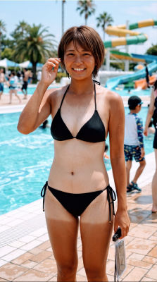 AI-generated image of a woman in swimwear at a water park