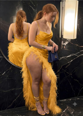 Deepfake of Sadie Sink in a yellow feather-trimmed gown