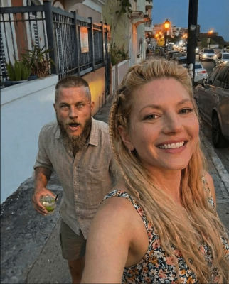 AI-generated image of Katheryn Winnick and Travis Fimmel on a street