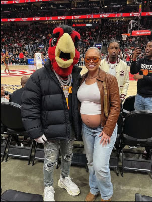 AI-generated image of 21 Savage in Atlanta Hawks mascot costume at State Farm Arena