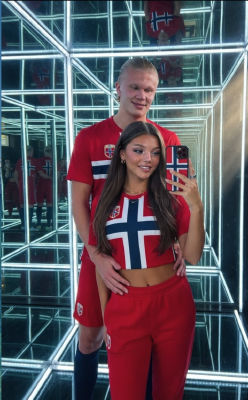 AI-generated mirror selfie of Erling Haaland and a woman in Norway national team jerseys
