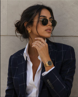 AI-generated portrait of a woman in a navy blazer and sunglasses