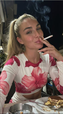 AI-generated image of a woman smoking at a restaurant table