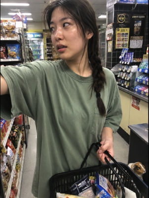 AI-generated selfie of a woman in a Korean convenience store