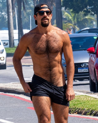 AI-generated image of Nicolas Prattes shirtless at a street