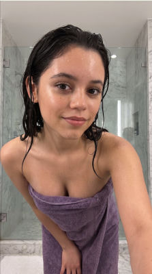AI-generated image of Jenna Ortega wrapped in a towel in a bathroom