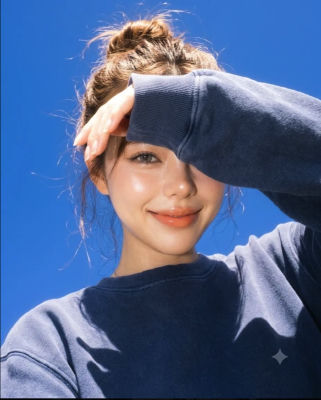 AI-generated selfie of an unidentified woman against a blue sky