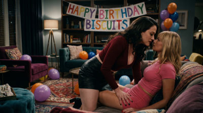AI-generated deepfake of Kat Dennings and Beth Behrs in suggestive 2 Broke Girls-style scene