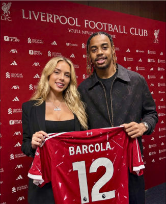 AI-generated image resembling Robert Ri'chard presenting a Liverpool FC jersey with 'BARCOLA 12'