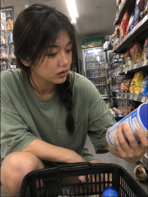 AI-generated image of an unidentified young woman in a convenience store