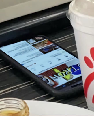 AI-generated image of a phone displaying a Kanye West social media post