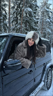 AI-generated image of an unidentified woman in a fur coat by an SUV in the snow