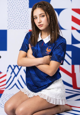 AI generated image of a woman wearing a France national football jersey