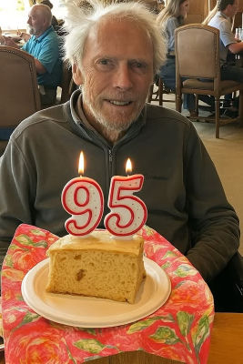 AI-generated image of Clint Eastwood with a 95th birthday cake