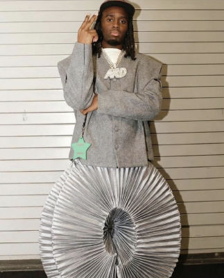 AI-generated image of Kai Cenat wearing a gray cardigan and pleated silver skirt