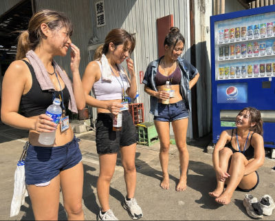 AI-generated image of four women taking a break near a Japanese vending machine