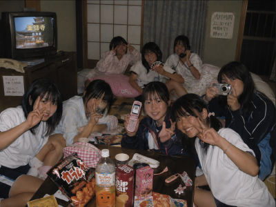 AI-generated group photo of young women in a Japanese-style inn room