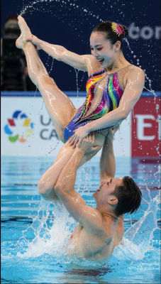 AI-generated image of a woman performing an artistic swimming lift
