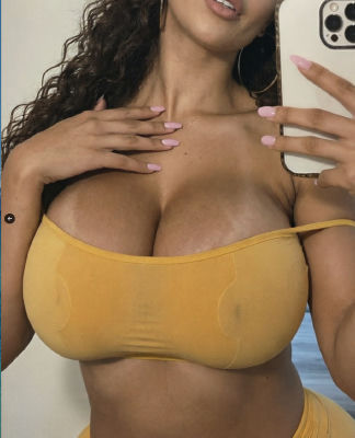 AI-generated mirror selfie of an unidentified woman in a yellow bikini