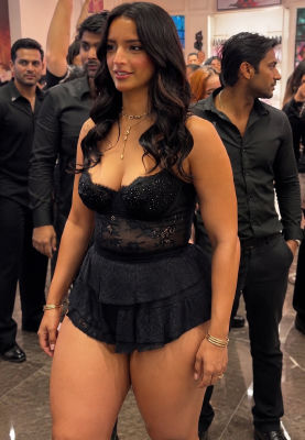 AI-generated image appearing to show Triptii Dimri in a black lace outfit at an event