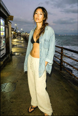 AI-generated image of woman on a coastal pier