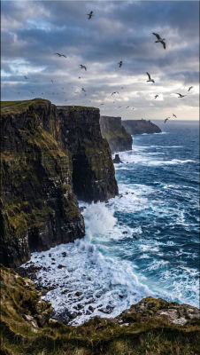 AI-generated coastal cliff landscape with seabirds over crashing waves