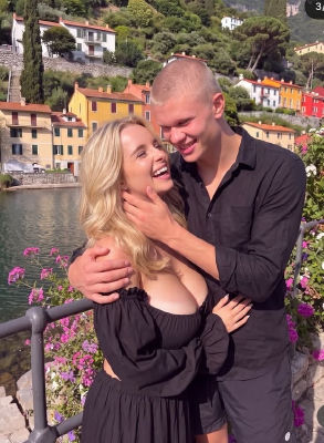 AI-generated image of Erling Haaland embracing a woman at an Italian lakeside village