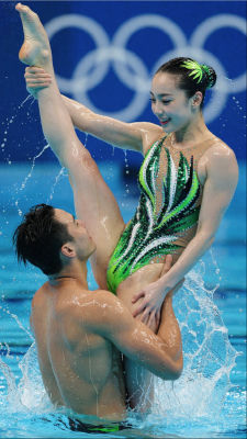 AI-generated image of a woman performing an artistic swimming lift at the Olympics