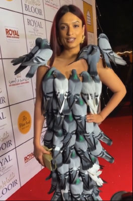 AI-generated image of a woman in a pigeon-ornament dress on a red carpet