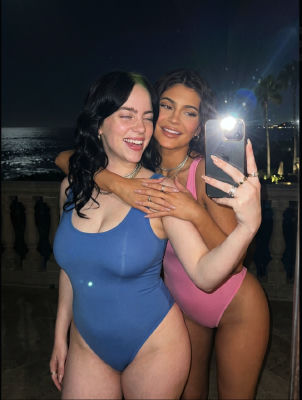 Deepfake of Billie Eilish and Kylie Jenner taking a nighttime beach mirror selfie