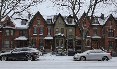 AI-generated image of Victorian townhouses on a snowy street