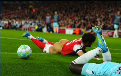 AI-generated image of soccer match with player fallen on the pitch