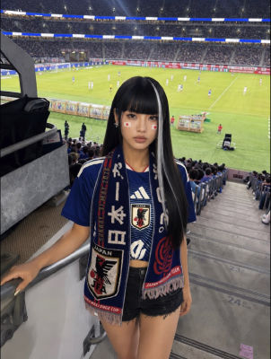 AI-generated image of a woman resembling Nana Komatsu at a Japan national team football match
