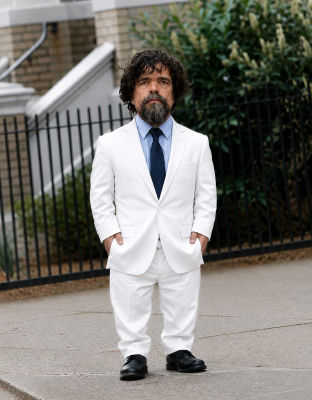 AI-generated image of Peter Dinklage in a white suit at an event