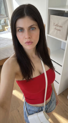 AI-generated image of Alexandra Daddario in a red tube top and denim shorts
