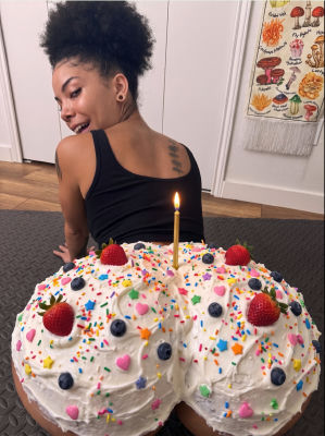 AI-generated image of an unidentified woman with a birthday cake