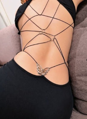 AI-generated image of a woman in a backless strappy black dress