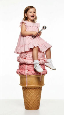 AI-generated image of a child sitting on a giant ice cream cone