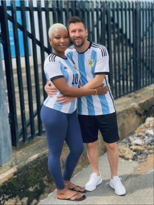 AI-generated image of Lionel Messi embracing a woman in Argentina jerseys